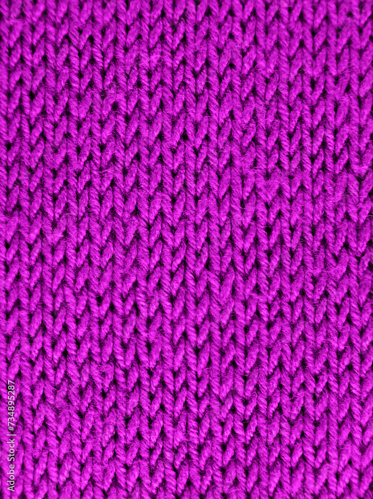 Texture of knitted wool fabric with of a pink color. Close-up. Selective focus. Texture of knitted wool fabric with of a pink color. Close-up. Selective focus.