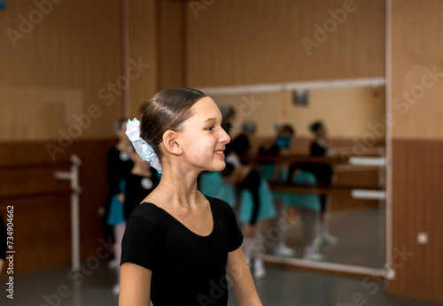 Young beautiful dancer training in the dance hall