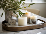 A marble tray with scented candles creates