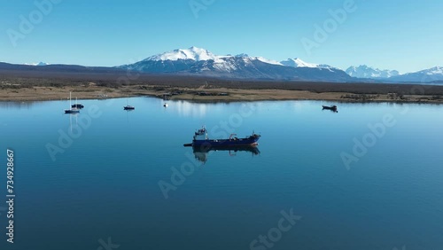 Boat Sailing At Puerto Natales Magallanes Region Chile. Boats Puerto Natales Magallanes Region. Outdoor Tourism Icon Patagonia Glacier. Outdoor Outside Patagonia Snow Covered Above View. photo