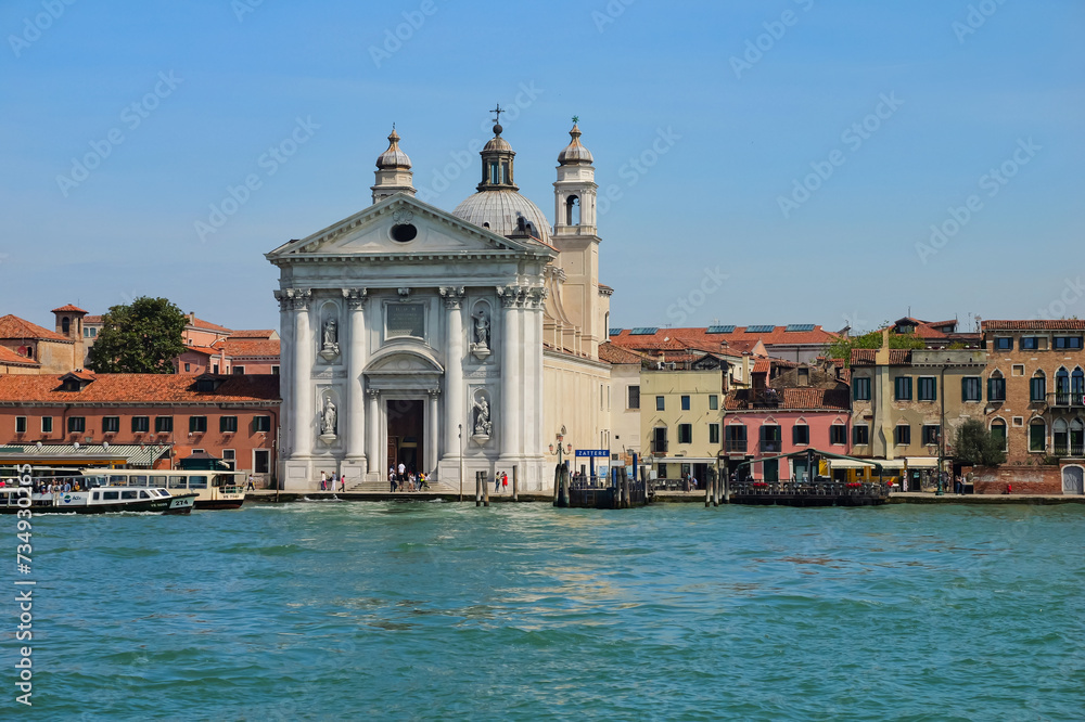 View from the window of the catamaran on the Venetian lagoon and the architecture of Venice, Italy.	