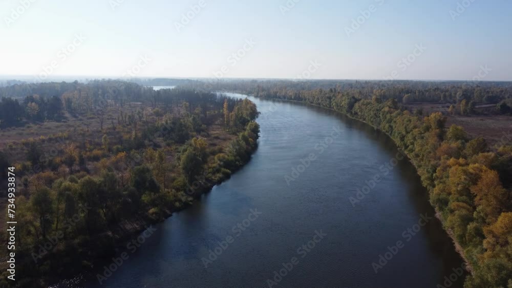 River with banks overgrown with trees at autumn, aerial view River with banks overgrown with trees at autumn, aerial view