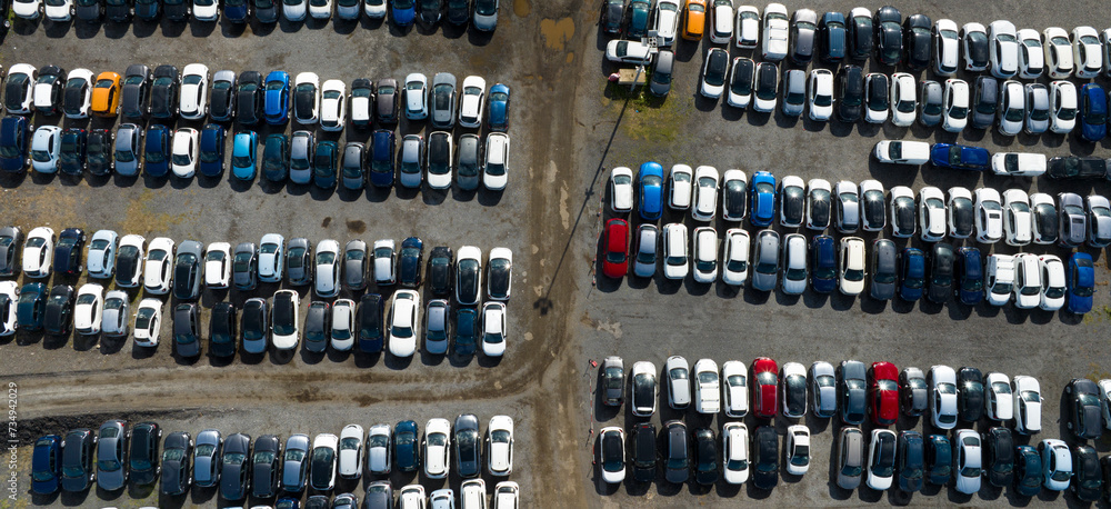 Perpendicular aerial view of many cars parked and ready for sale and distribution on the international market. Perpendicular aerial view of many cars parked and ready for sale and distribution on the international market.