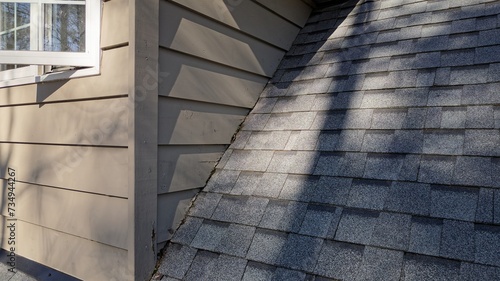 Drone view of damaged rotten wood siding along shingles due to improper siding flashing installation