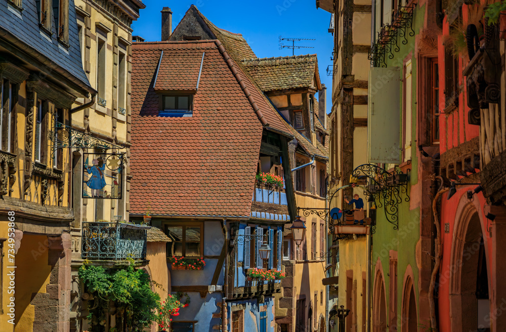 Traditional colorful half timbered houses in a popular village on the Alsatian Wine Route in Riquewihr, France