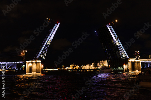 Opening purple bridges in St. Petersburg at night in Russia