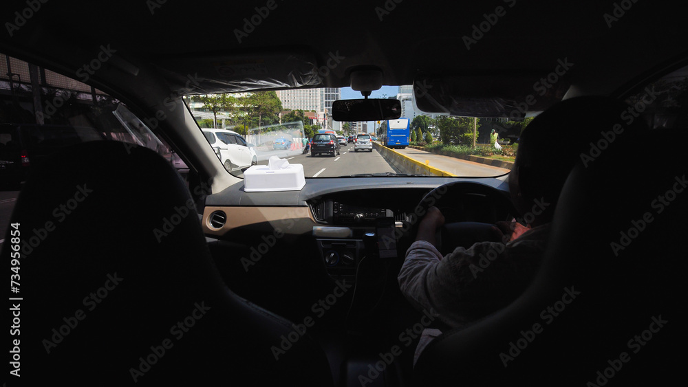 Inside the interior of a cab car in Jakarta. Indonesia.