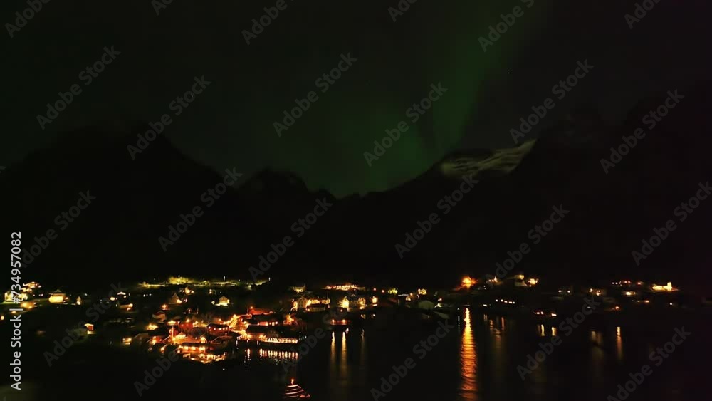 Mystical Skies: Northern Lights over Reine Village, Norway Mystical Skies: Northern Lights over Reine Village, Norway