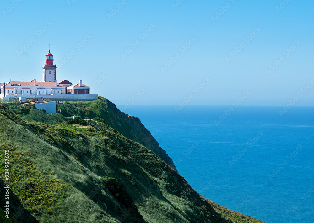 White lighthouse on cliffs with sea view Cabo da Roca. Portugal