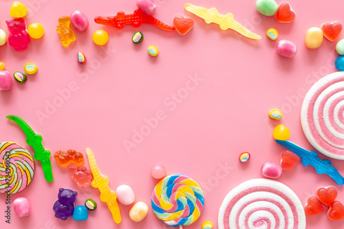 Flat lay of colorful candies and lollipop. Sweet food and candies background