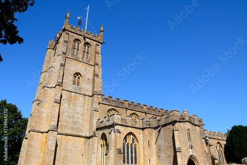 View of All Saints church along Church Street, Martock, Somerset, UK, Europe.