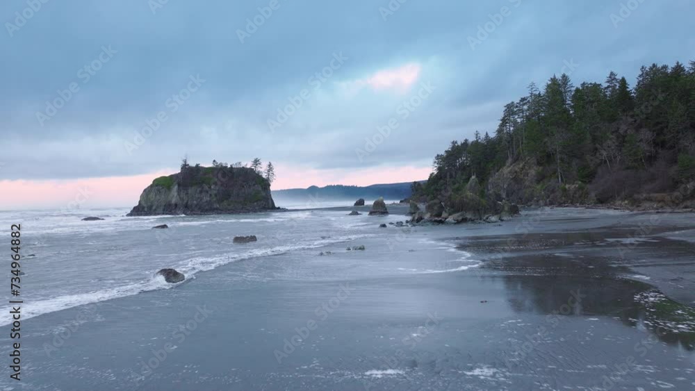 Washington State, aerial of cinematic Olympic National Park. Dramatic sea stacks on rocky Ruby Beach along the Olympic coastline on moody overcast evening. Ruby Beach on West Coast of Northern America Washington State, aerial of cinematic Olympic National Park. Dramatic sea stacks on rocky Ruby Beach along the Olympic coastline on moody overcast evening. Ruby Beach on West Coast of Northern America