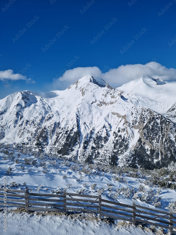 Wonderful Pirin mountains peaks covered with snow. Winter view at Bansko ski resort in Bulgaria