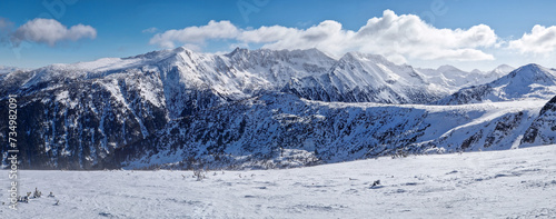Beautiful panorama of balkan mountains ridge. Rocky peaks covered with snow in Bulgaria