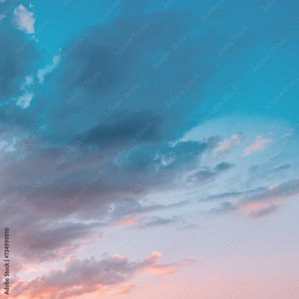 Fototapeta premium Pastel delicate blue and pink clouds. Sunrise