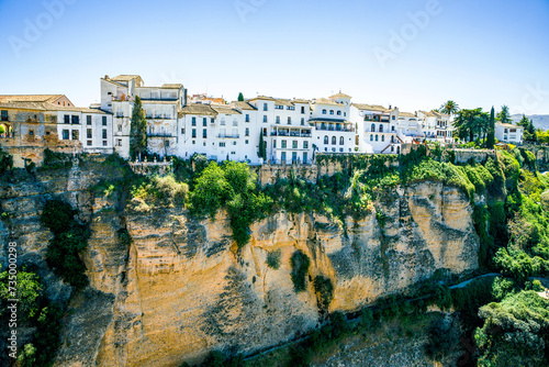 Ronda, Spain. Aerial evening view of New Bridge over Guadalevin River in Ronda, Andalusia, Spain. View of the touristic city. photo