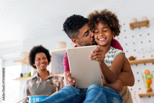 African family tablet and child learning at home with happiness  development  internet connection.