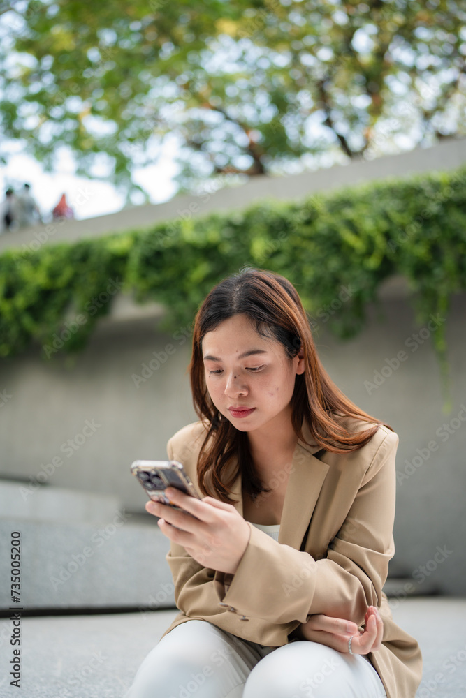 Business asian woman sitting outdoor office cafe use smartphone Business asian woman sitting outdoor office cafe use smartphone
