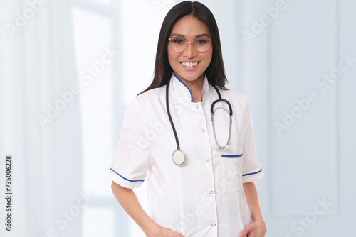 Positive doctor on a light background.