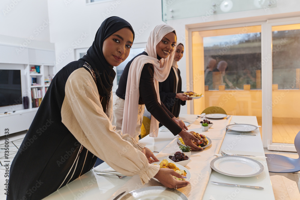 Group of young Arab women come together to lovingly prepare an iftar table during the sacred Muslim month of Ramadan, embodying the essence of communal unity, cultural tradition, and joyous Group of young Arab women come together to lovingly prepare an iftar table during the sacred Muslim month of Ramadan, embodying the essence of communal unity, cultural tradition, and joyous