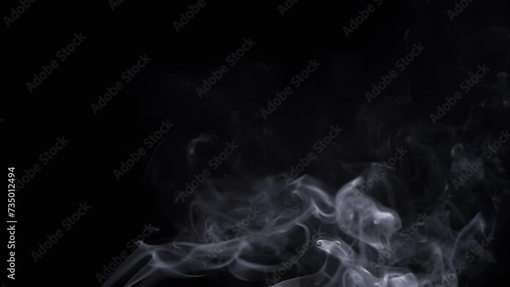 Thin Curls of White Smoke Rise Up, Filling Empty Space. Black Background. Incense sticks. Smog. Abstract shapes. Mist. Texture. Clouds. Smoke swirl. Floating fog, flowing smoke. Blurred motion. Light.