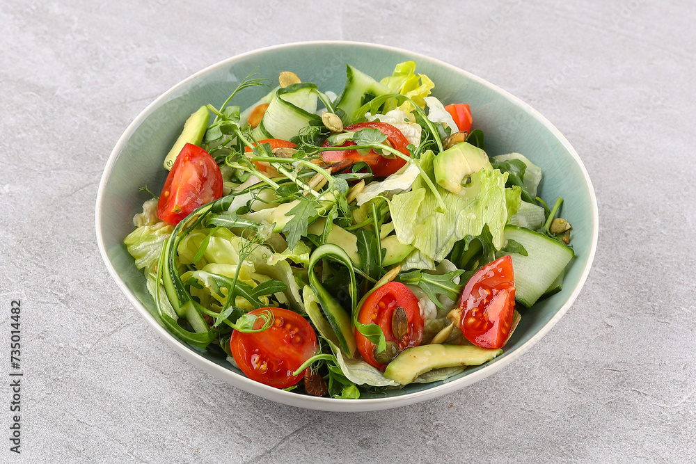 salad with tomatoes and cucumbers on a stone background, studio food photography 1