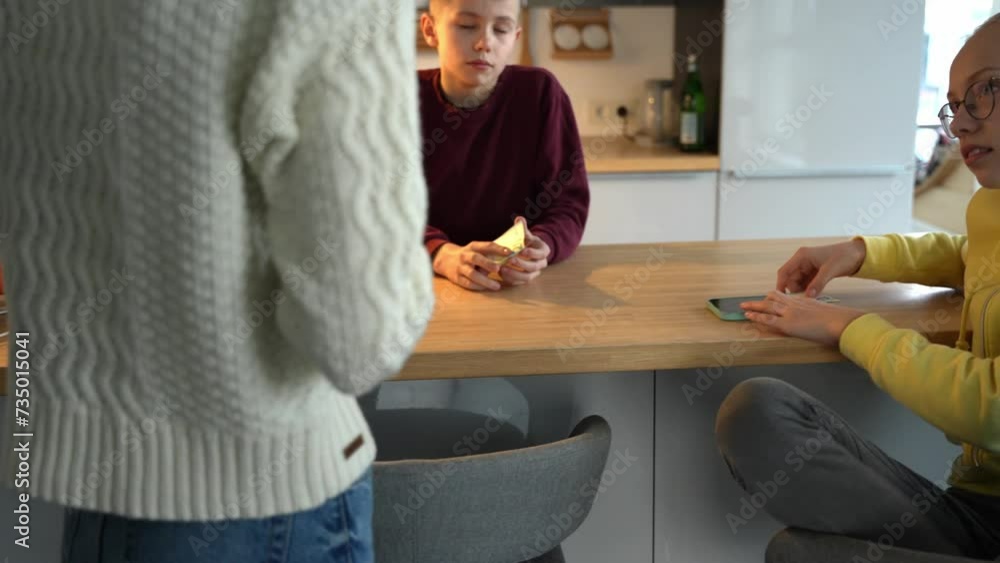 Mother giving pocket money for her kids weekend activities. Euro currency banknote. Mother giving pocket money for her kids weekend activities. Euro currency banknote.