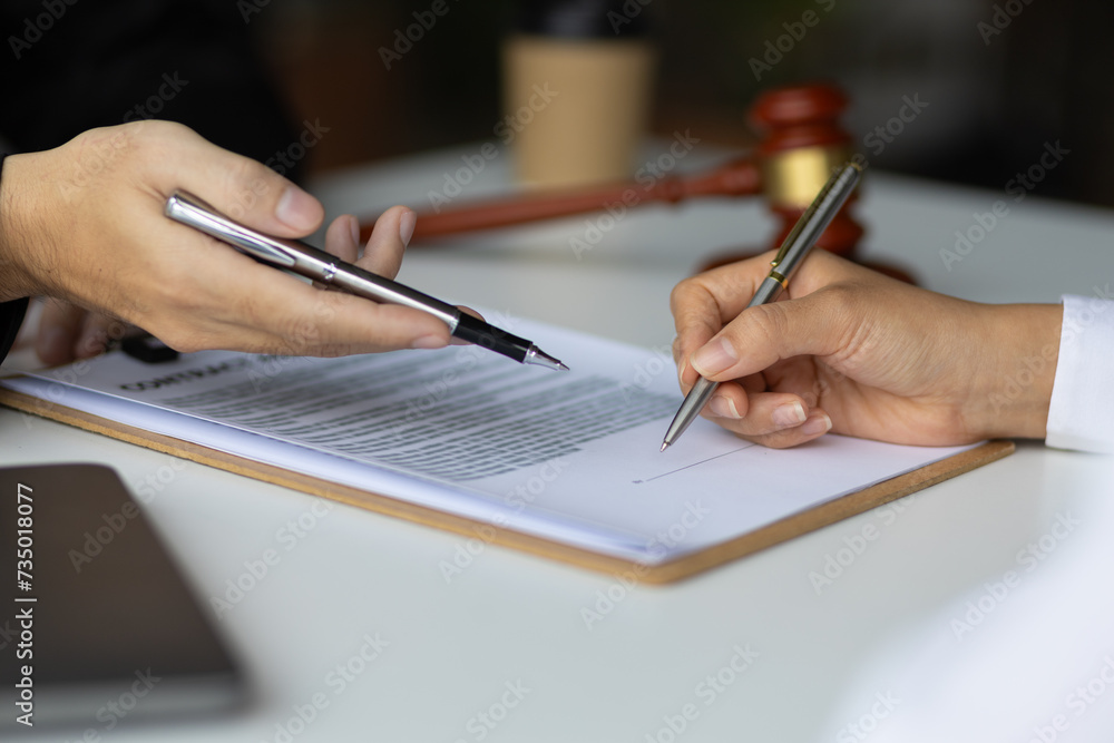 Signing a legal contract agreement. Lawyer, Legal Counsel and Legal Justice Signing a legal contract agreement. Lawyer, Legal Counsel and Legal Justice