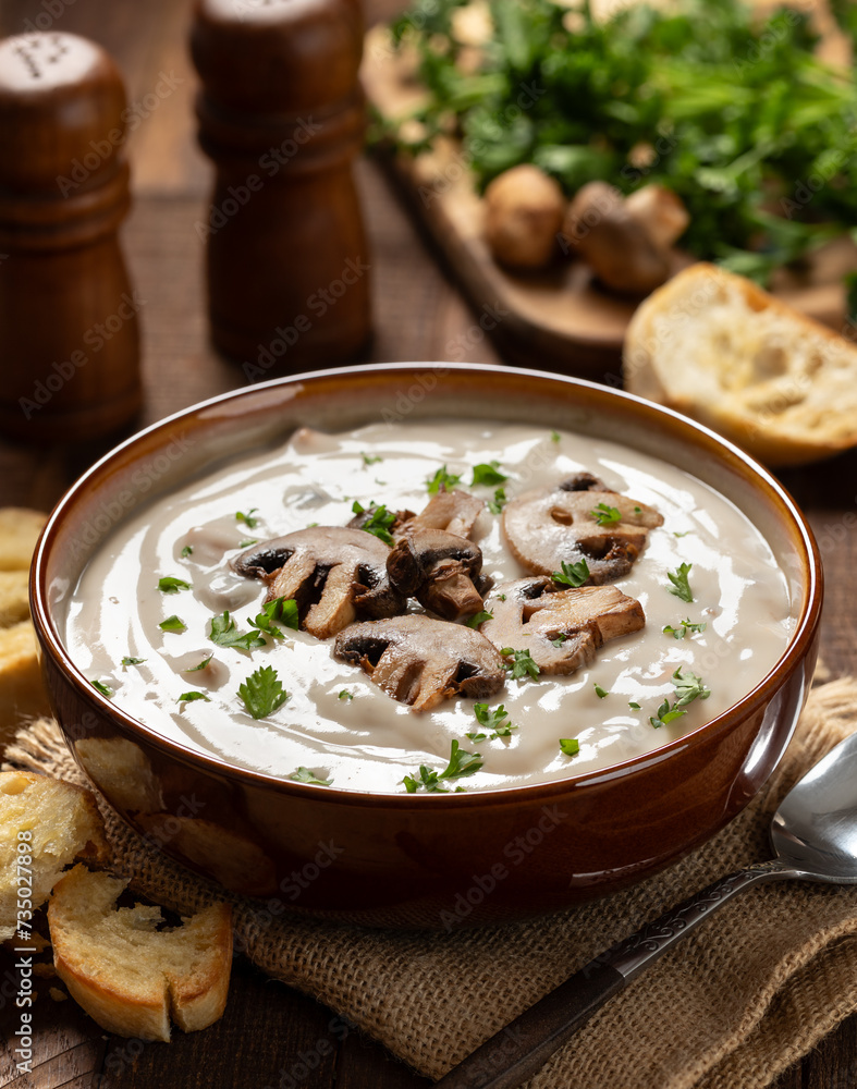 Creamy mushroom soup with sliced mushrooms and parsley Creamy mushroom soup with sliced mushrooms and parsley