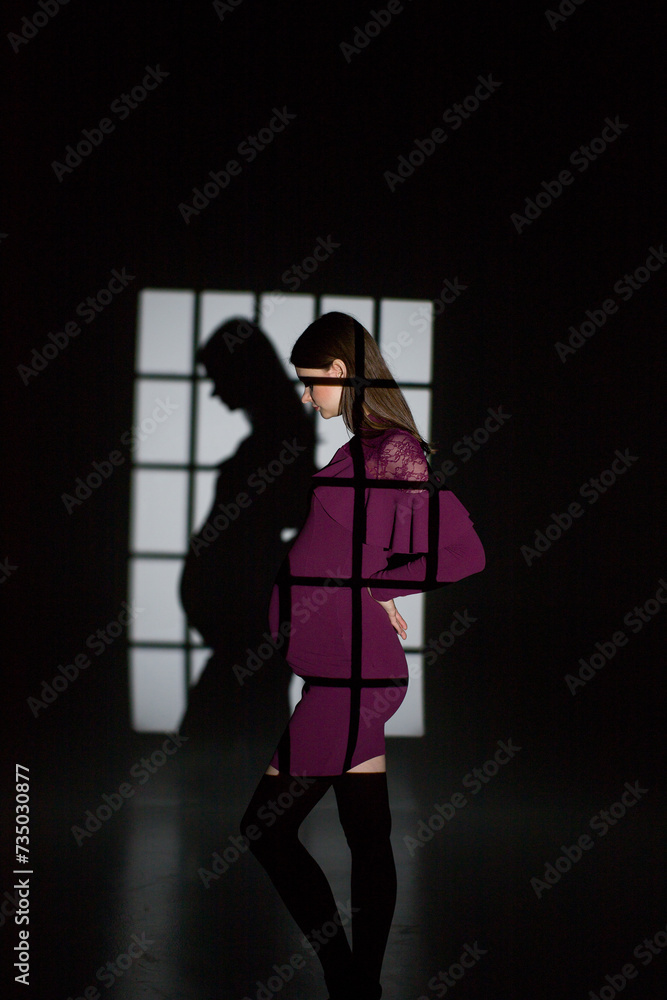 fashion pregnant model posing in studio on a black background, studio pregnancy shoot, fashion pregnancy, pregnant woman in a dress, person in the window fashion pregnant model posing in studio on a black background, studio pregnancy shoot, fashion pregnancy, pregnant woman in a dress, person in the window