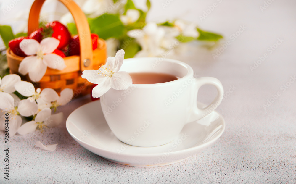 Cup of tea with white apple blossoms. Spring concept. Cup of tea with white apple blossoms. Spring concept.