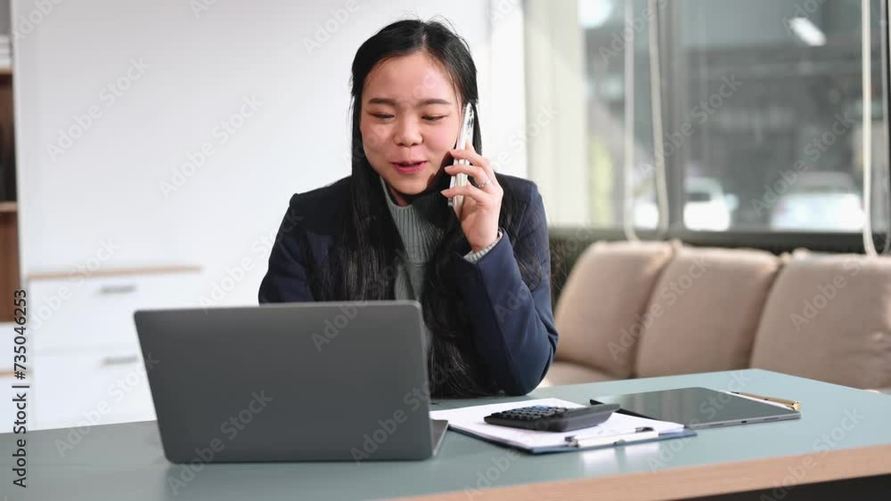 Young beautiful woman using laptop and tablet while sitting at her working place. Concentrated at work.
Young beautiful woman using laptop and tablet while sitting at her working place. Concentrated at work.