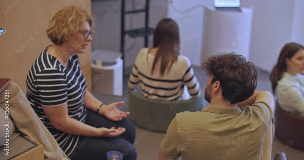 High view of a amphitheater room during a business seminar, a group of international and multiage people engage in discussions and interactions. Business group attending class seminar, work education High view of a amphitheater room during a business seminar, a group of international and multiage people engage in discussions and interactions. Business group attending class seminar, work education