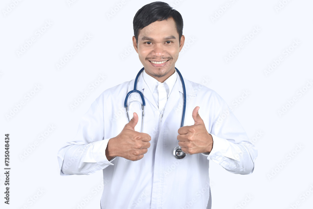Portrait of doctor with stethoscope and showing thumbs up on white background. Portrait of doctor with stethoscope and showing thumbs up on white background.