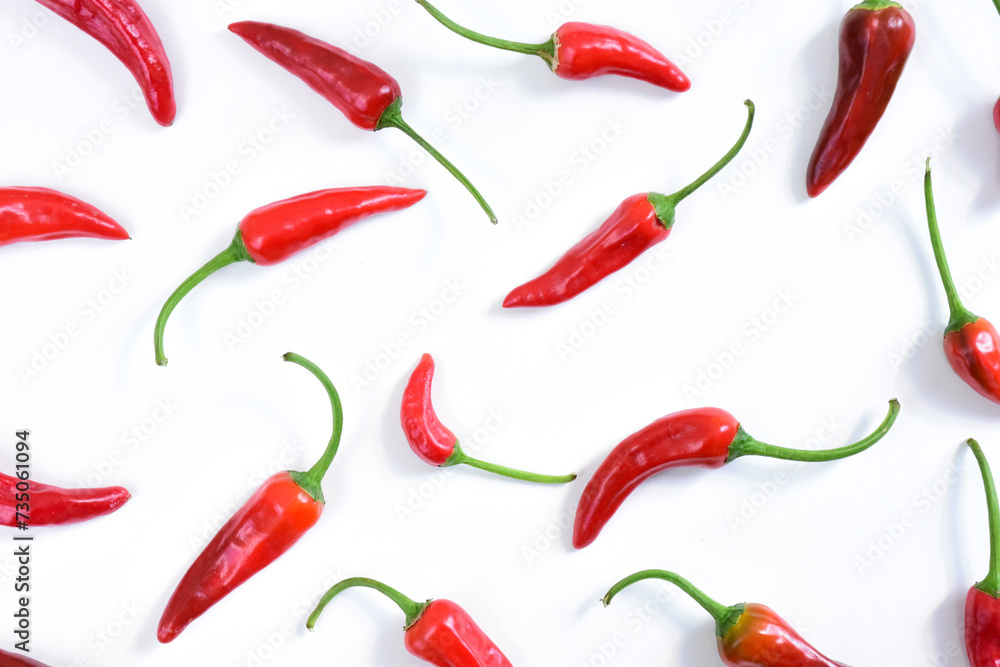 Hot chilli peppers pattern. Cayenne peppers isolated on white background. Hot chilli peppers pattern. Cayenne peppers isolated on white background.