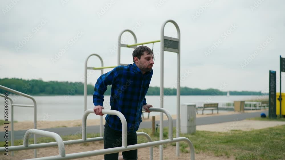 Young strong man exercising on the beach Young strong man exercising on the beach