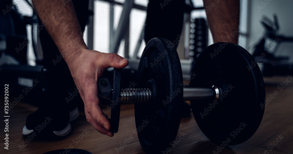 dumbbells and exercise equipment in the gym dumbbells and exercise equipment in the gym