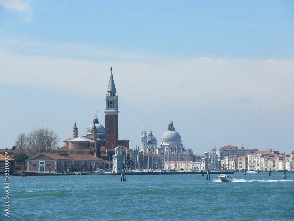 Fototapeta premium San Giorgio Maggiore island, bell tower, church and boats in Venice on a sunny spring day