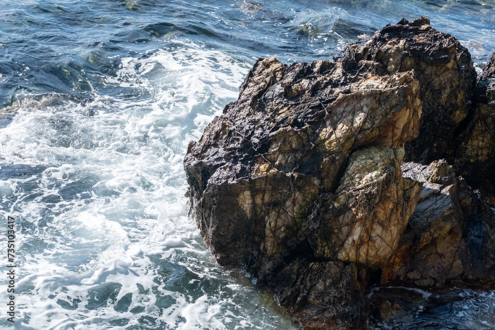 waves crashing on rocks