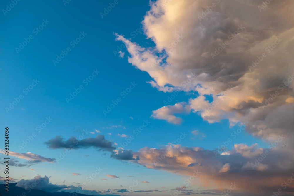 Scenic sunset view of magical pink cloud formations seen from Altfinkenstein at Baumgartnerhoehe, Carinthia, Austria. Calm serene atmosphere. Cloudscape against blue sky. Heaven like feeling
