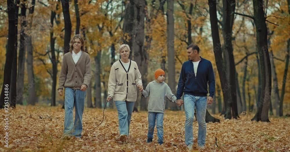 active rest in nature in autumn, happy family walking holding hands in park, 4K, Prores active rest in nature in autumn, happy family walking holding hands in park, 4K, Prores