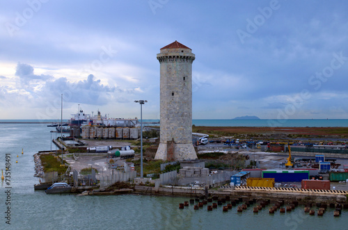 Picturesque landscape view of medieval Marzocco Tower in Livorno, Italy. Ancient watchtower, built in 15th century. Inside the port area in the north of the city. Travel and tourism concept