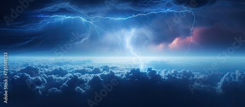 Upward Lightning from a Cumulonimbus thundercloud From the anvil of a thunderstorm lightning bolts shoot upwards into the stratosphere. Creative Banner. Copyspace image photo