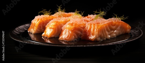 Sushi roll with fried salmon on black plate. Creative Banner. Copyspace image