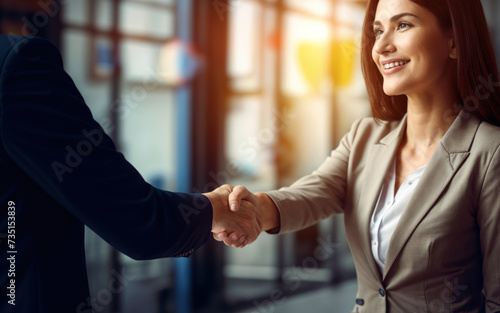 Businesswoman shaking hands in office. Successful teamwork and partnership, demonstrating professionalism and collaboration in corporate environment