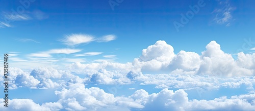 White clouds in the blue or azure sky a captivating vision of boundless serenity and beauty This stunning image transports you to a world of tranquility. Creative Banner. Copyspace image