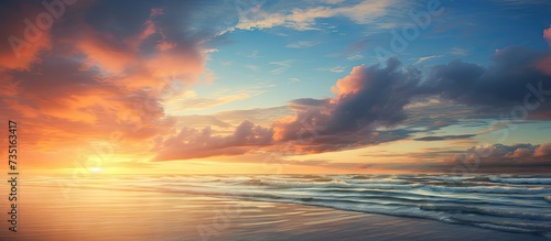 The sun rises over the sea at Bournemouth illuminating the clouds and the sea. Creative Banner. Copyspace image photo