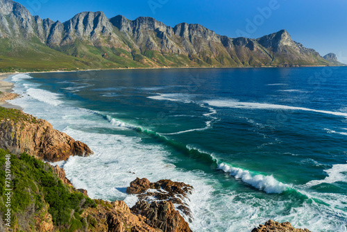 Glorious view of the Kogelberg mountains across False Bay along Clarence Drive between Gordon's Bay and Rooi-Els near Cape Town, Western Cape. South Africa. photo