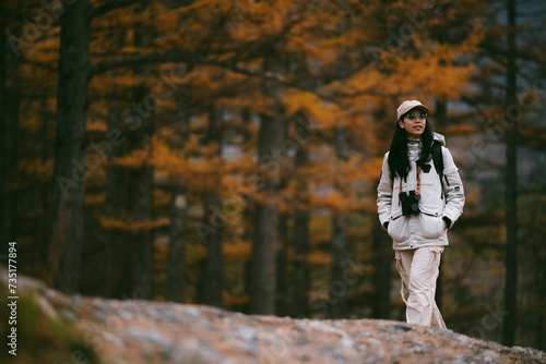 Asian woman person in nature forest portrait concept, attractive young female asian pretty girl with beautiful face are happy and joy outdoor lifestyle at tree park background, summer travel vacation