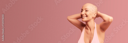 Portrait of a happy woman with cancer in pink background